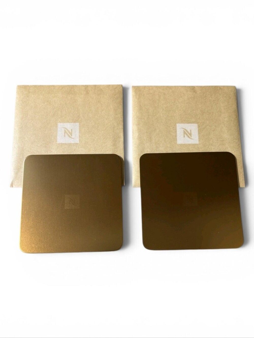 NEW Nespresso Set of 2 Bronze Gold Coasters 25% Recycled Aluminum Cork Backed